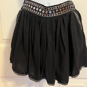 Justice black skort with silver sparkly trim along waistline and hem sz 12